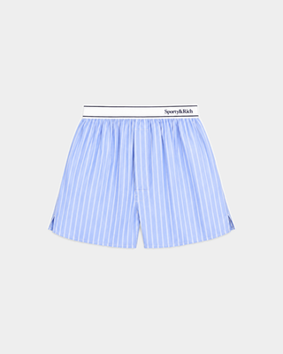 Beth Serif Logo Boxer - Blue Striped, crafted from breathable cotton with light blue pinstripes, features a relaxed fit and a white waistband labeled Sporty & Rich, displayed on a plain background.