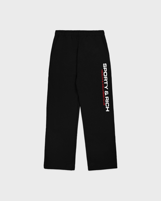 A person in a matching black hoodie and Blakely Bold Health Wide Sweatpant - Black with white lettering.
