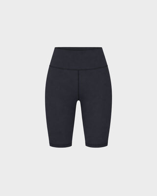 Brooke Bold Logo Biker Short - Black: High-waisted black biker shorts with a 6-inch inseam and supportive high-rise waistband, shown against a plain white background.