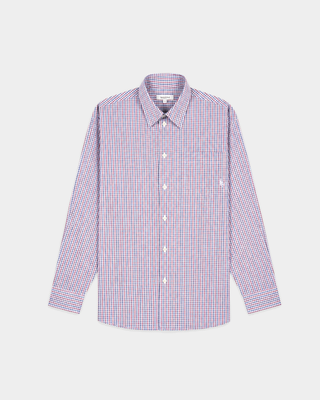 The Coco SRC Oversized Shirt - Blue White Red Check is a long-sleeve button-up featuring a small red, blue, and white checkered pattern, crafted from breathable poplin and displayed laid flat on a white surface.