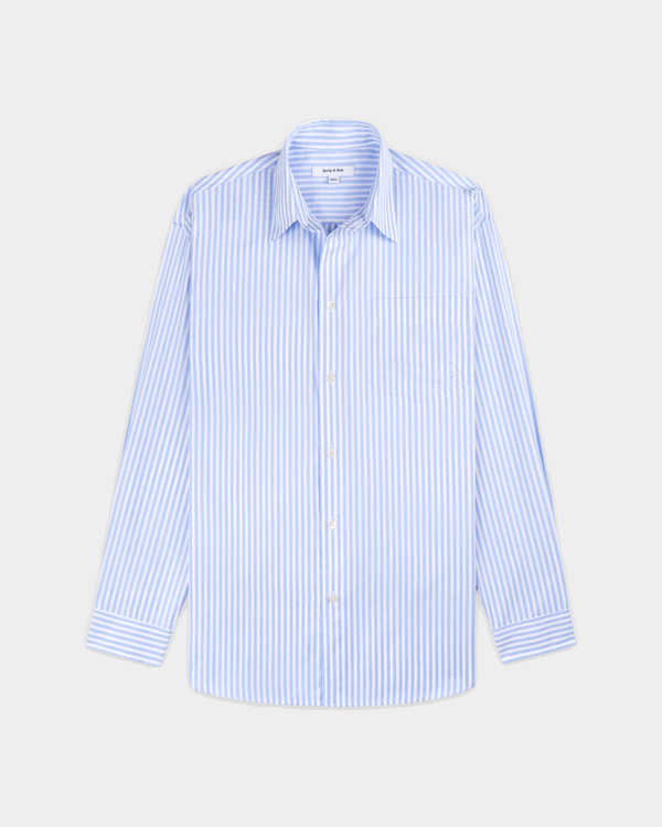 Coco SRC Oversized Shirt in a light blue and white vertical stripe pattern with a relaxed-fit, long-sleeve design.
