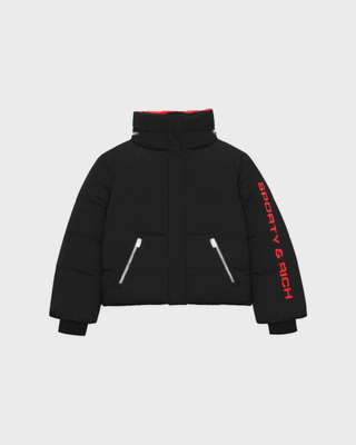 Drea Bold Logo Ski Jacket in black with an oversized fit, red interior collar, and red sleeve text.