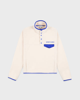 Emma Bold Logo Polar Sweatshirt in cream-colored polyester fleece with a snap-button placket and blue trim.