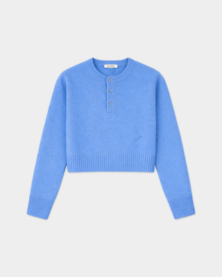 Iba S Logo Cashmere Henley in true blue, featuring a cropped fit, ribbed hem, cuffs, and an embroidered chest logo.