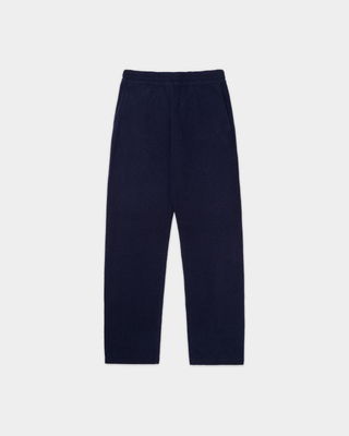 Ivana S Logo Cashmere Trousers in dark navy, laid flat on a light grey background, featuring an elasticated drawstring waist for added comfort.