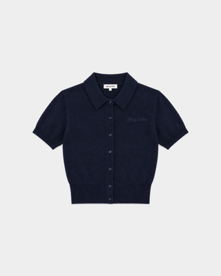 Jannie Signature Logo Cashmere SS Cardigan in Dark Navy—this cropped, short-sleeve knit features a button front, classic collar, and subtle signature embroidery on the left chest for a modern touch.
