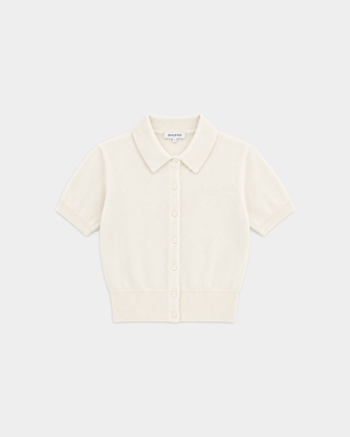 Jannie Signature Logo Cashmere SS Cardigan in Off White, featuring a short-sleeve cropped design with front buttons, displayed on a plain background.