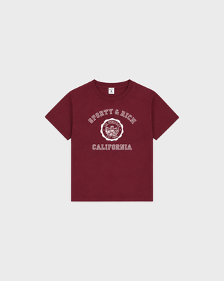 Karen California Emblem Kids Tshirt - Merlot: a soft, maroon short-sleeved tee with a white Sporty & Rich graphic.