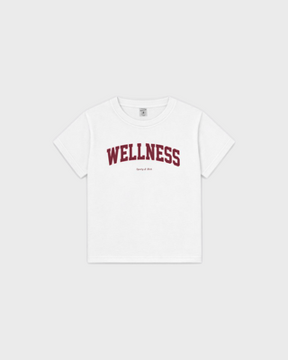 Karen Wellness Ivy Kids Tshirt - White: soft, breathable short-sleeve tee with WELLNESS in dark red varsity lettering.