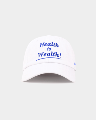 Maeve Health is Wealth Hat - White: a vintage baseball cap with an adjustable back and blue embroidered text.