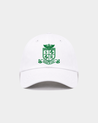 Maeve SRCC Hat - White, a vintage baseball cap with an adjustable back and green crest logo on the front.