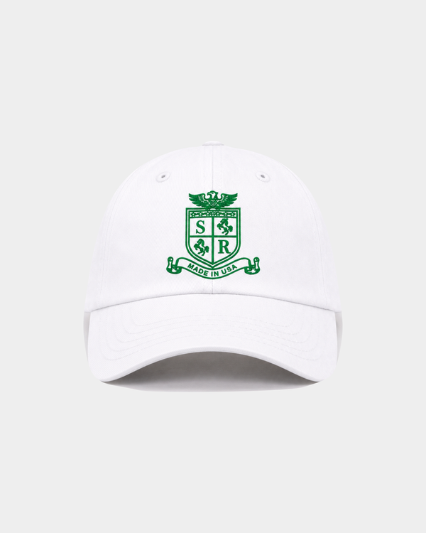Maeve SRCC Hat - White, a vintage baseball cap with an adjustable back and green crest logo on the front.