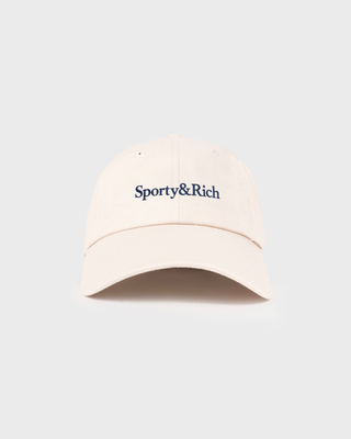 A light beige baseball cap with 'Sporty&Rich' embroidered in navy blue on the front, set against a solid light gray background.