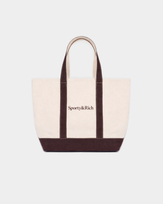 Mona Serif Logo Medium Tote in natural cotton with dark brown trim, handles, and a brown logo on the front.
