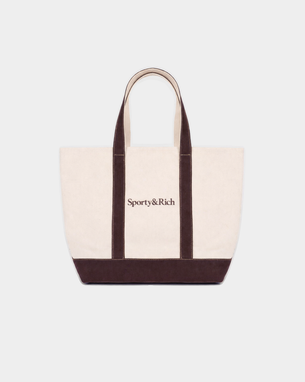 Mona Serif Logo Medium Tote in natural cotton with dark brown trim, handles, and a brown logo on the front.