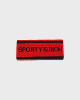 A red knit headband with black stripes at the top and bottom and the brand name 'SPORTY & RICH' printed in black across the front, shown on a light gray background.