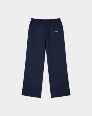 Besma Serif Logo Embroidered Baggy Sweatpant in dark navy, featuring an oversized fit with an elastic waistband and side pockets, laid flat on a white background.