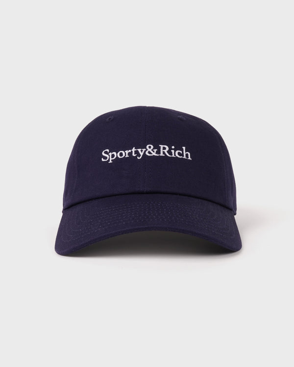 The Maeve Serif Logo Hat in Dark Navy features “Sporty & Rich” embroidered in white on the front and includes an adjustable back closure for a comfortable fit.