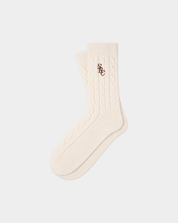 Cream-colored Sidi SRC Cashmere Cableknit Socks with a brown embroidered logo on the ankle.