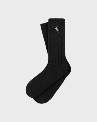 Pair of black Sole SRC Wide Rib Cashmere Socks with white logo embroidery on the cuff.