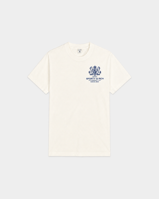 Cameron SR Hotel Tshirt - Off White features a blue crest and “Sporty & Rich Health Club” text on the left chest, crafted from 100% cotton for all-day comfort. This unisex T-shirt is a classic addition to any casual wardrobe.