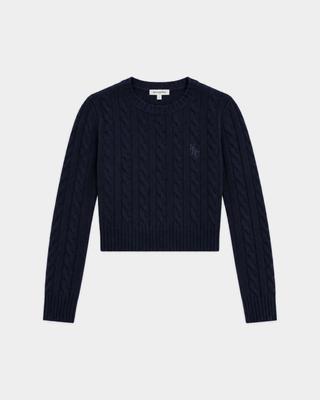 Jala SRC Cable Cropped Sweater in dark navy, a slim-fit, long-sleeve cable knit featuring a crew neck and crafted from a luxurious cashmere-wool blend, laid flat on a white background.