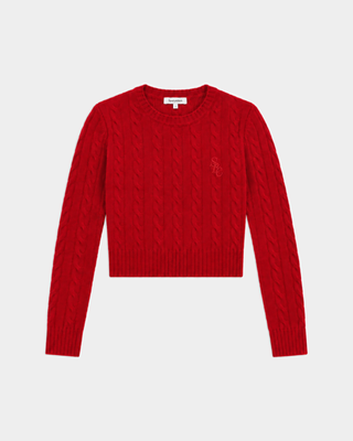 Jala SRC Cable Cropped Sweater in Ruby, featuring a slim fit, long sleeves, cable-knit design, and crew neck, laid flat on a white background.