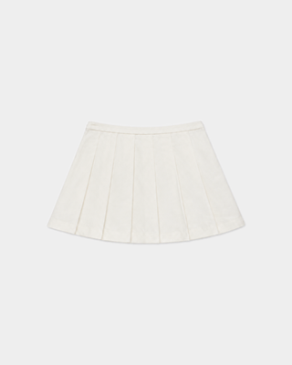 Anais Riding Skirt in ecru, an off-white pleated equestrian skirt with gold-tone horsebit hardware at the waist.