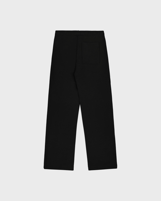 A person in a matching black hoodie and Blakely Bold Health Wide Sweatpant - Black with white lettering.