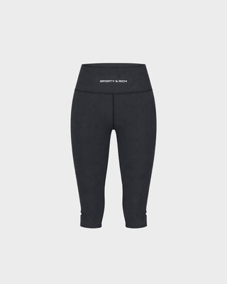 Capri Bold Logo Sports Capri - Black high-waisted cropped leggings displayed on a plain white background, perfect for those who love minimal style with a touch of ’90s shape.