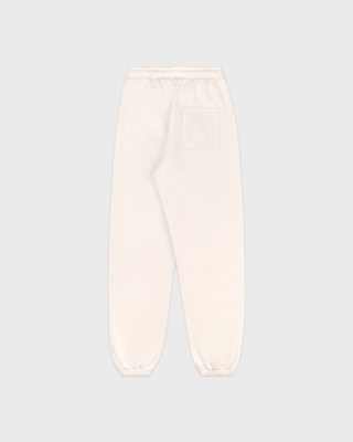 Woman wearing a cream-colored Sporty & Rich sweatshirt and matching Brianno Ski Club Jogger in a classic fit.