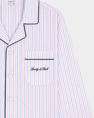Cardona Signature Logo Pyjama Shirt – Blue White Red Striped. This long-sleeve, button-up pyjama shirt features blue, red, and white stripes and a chest pocket. Designed with an oversized unisex fit and made from breathable cotton for all-night comfort.