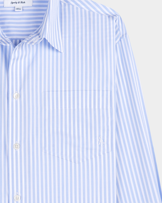 Coco SRC Oversized Shirt in a light blue and white vertical stripe pattern with a relaxed-fit, long-sleeve design.