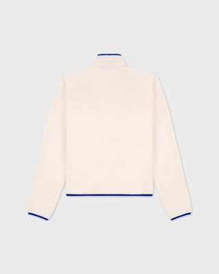 Emma Bold Logo Polar Sweatshirt in cream-colored polyester fleece with a snap-button placket and blue trim.