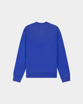 Vibrant blue Emmett Chateau Crewneck with a white circular logo featuring a ski lodge graphic.