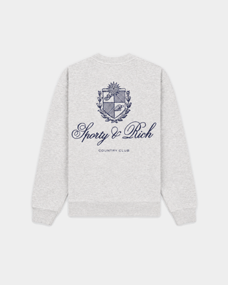 Emmett Club Script Crewneck in Heather Gray with small cursive text on the left chest, displayed on a white background. This relaxed fit sweatshirt channels the effortless appeal of vintage styles and is inspired by classic Sporty & Rich crewnecks.