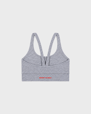 Flor Bold Logo Active Bra in medium heather gray with thin red side stripes and a racerback design.