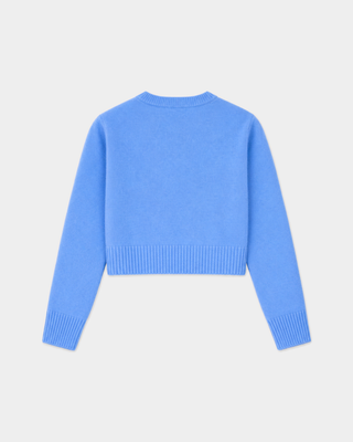 Iba S Logo Cashmere Henley in true blue, featuring a cropped fit, ribbed hem, cuffs, and an embroidered chest logo.