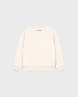 A cream long-sleeve crewneck sweatshirt featuring navy blue text on the chest that reads BE NICE. Get Lots Of Sleep.