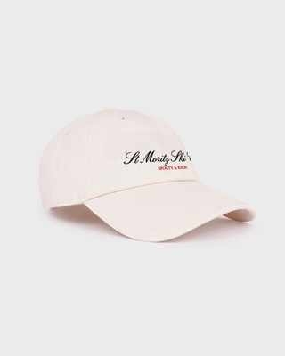 Cream Maeve Ski Club Hat embroidered with St. Moritz Ski Club in black script and red block letters.