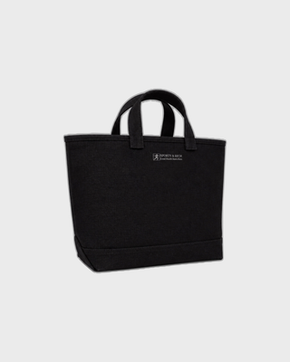 Maya Art OG Tote in black washed canvas, featuring the text THE ART of LIVING WELL printed on the front.