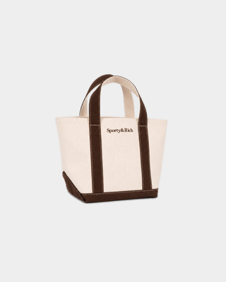 Minnie Serif Logo Mini Tote in natural cotton canvas with chocolate brown handles, base, and logo.