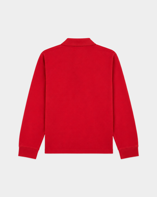 Perry Riding Club Longsleeve Pique Polo in Ruby features a collar and front pocket adorned with a circular white emblem, crafted from soft cotton piqué for enhanced comfort.