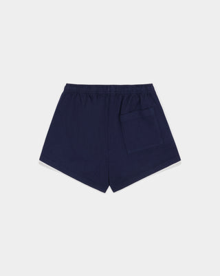 The Lucy Serif Logo Embroidered Disco Short in Dark Navy features an elastic waistband and Sporty & Rich text embroidered on the front left side, making these cotton lounge shorts perfect for a relaxed yet sporty look.