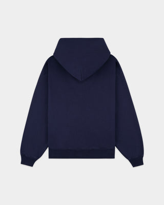 Emaro Serif Logo Embroidered Zip Hoodie in Dark Navy, laid flat. This relaxed fit hoodie features front pockets, an embroidered Sporty & Rich logo on the left chest, and an ultra-soft feel for everyday comfort.
