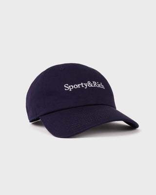The Maeve Serif Logo Hat in Dark Navy features “Sporty & Rich” embroidered in white on the front and includes an adjustable back closure for a comfortable fit.