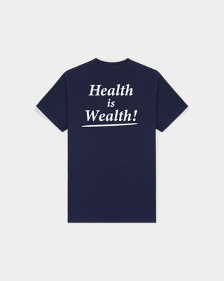 The Fema Serif Logo T-shirt in Dark Navy features a short-sleeve, unisex design with text on the left chest, crafted from 100% cotton and shown laid flat on a white background. This Sporty & Rich tee offers both comfort and timeless style for any wardrobe.