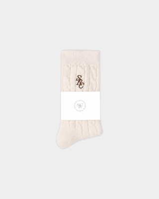 Cream-colored Sidi SRC Cashmere Cableknit Socks with a brown embroidered logo on the ankle.