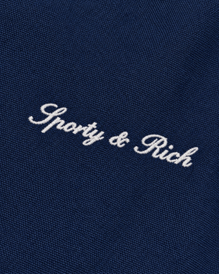 Gora Signature Logo Brighton Jacket in Dark Navy, featuring a collar and Sporty & Rich text on the left chest, laid flat on a white background.