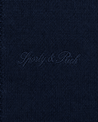 Jannie Signature Logo Cashmere SS Cardigan in Dark Navy—this cropped, short-sleeve knit features a button front, classic collar, and subtle signature embroidery on the left chest for a modern touch.